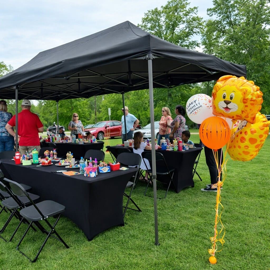 Backyard party package with black canopy, tables, chairs, and linens